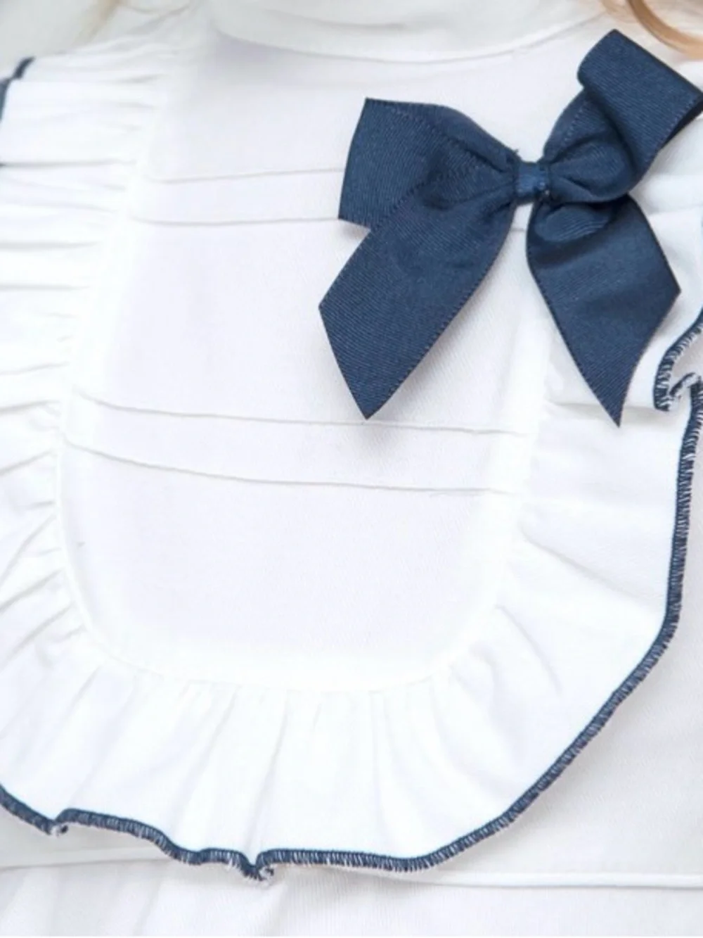 White Ruffle Neck Peplum Top with Navy Bow